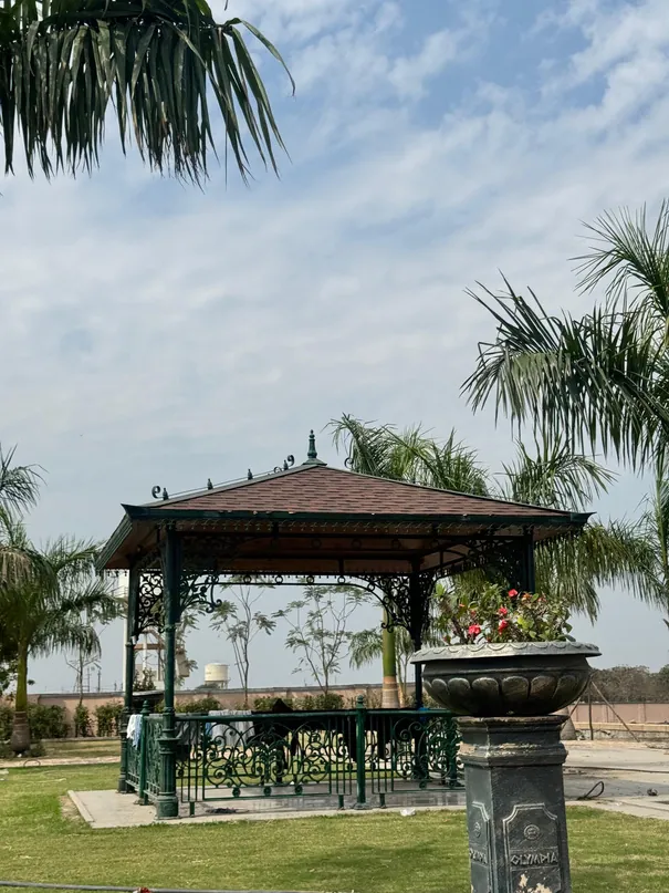 Gazebo surrounded by palms in the garden at Siddhi Olympia (actual photo)